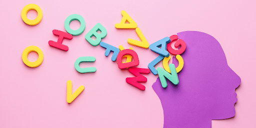 A purple paper head with a jumble of colorful letters spilling out from it