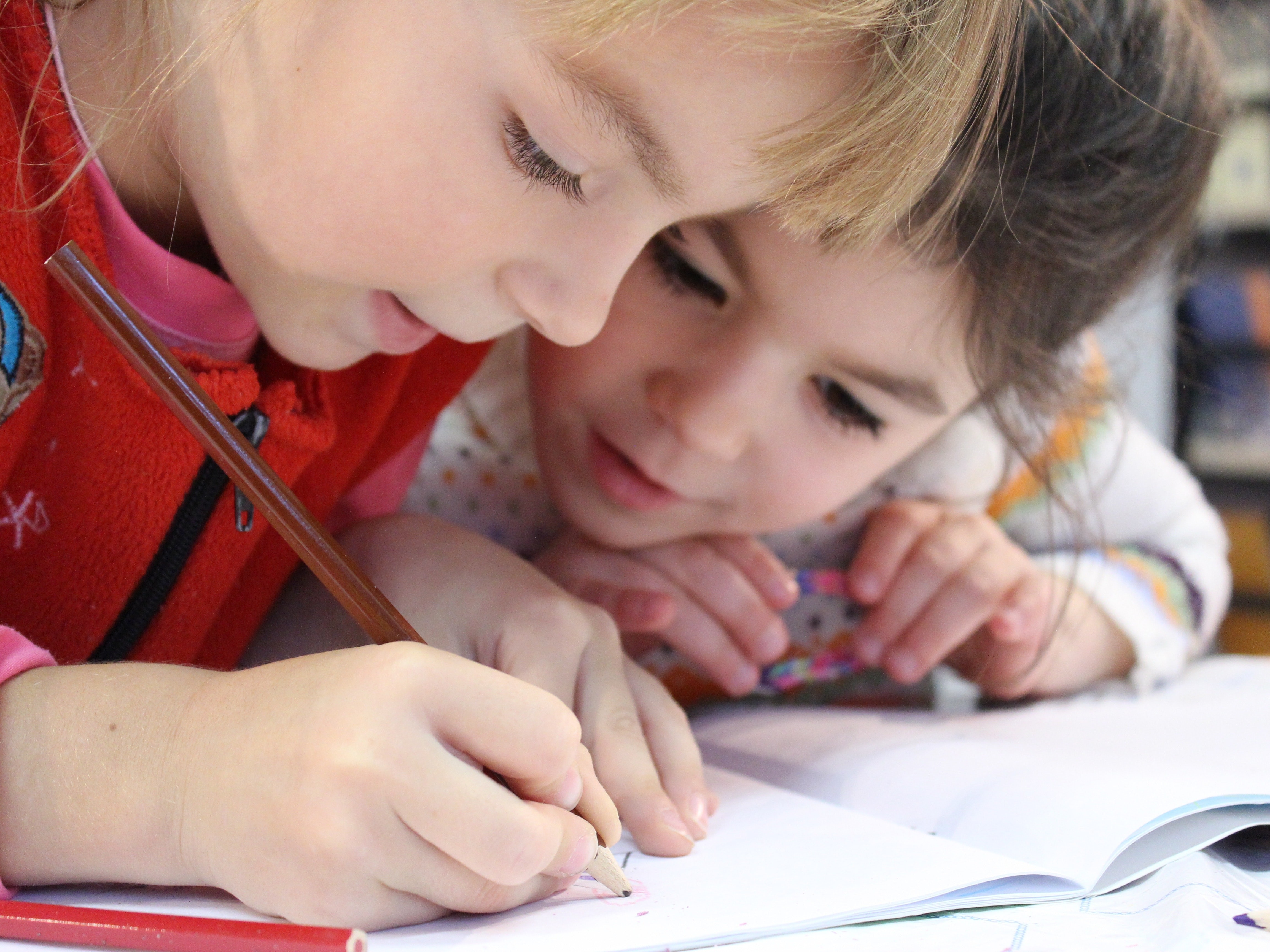 Two children drawing together
